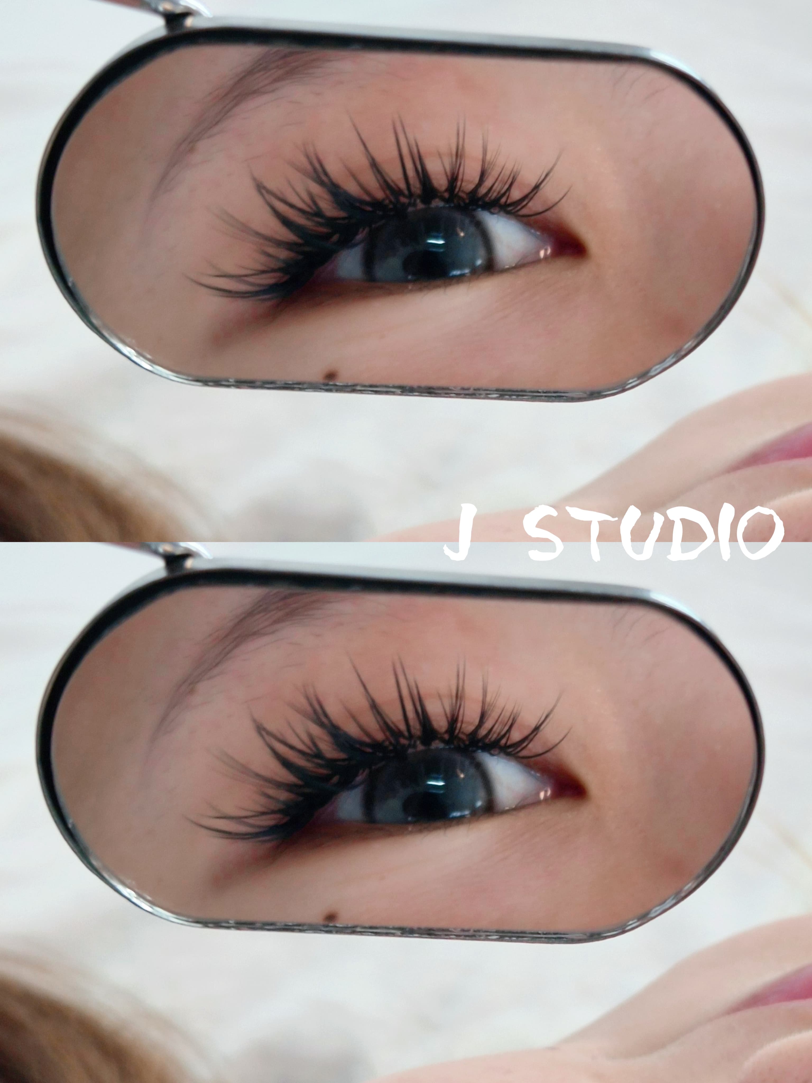 Close-up of a lash set reflected in a hand mirror
